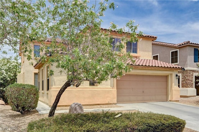 4308 Desert Haven Ave, North Las Vegas, NV 89085 - mediterranean / spanish house with stucco siding, driveway, a tiled roof, and a garage
