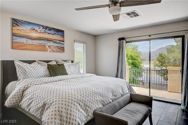 4308 Desert Haven Ave, North Las Vegas, NV 89085 - bedroom with multiple windows, access to outside, a mountain view, and ceiling fan