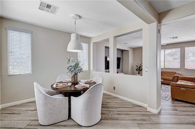 4308 Desert Haven Ave, North Las Vegas, NV 89085 - dining room with light wood finished floors and baseboards