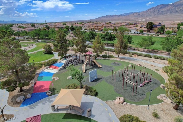 4308 Desert Haven Ave, North Las Vegas, NV 89085 - aerial view of residential area featuring a mountainous background, a community park, and a pool