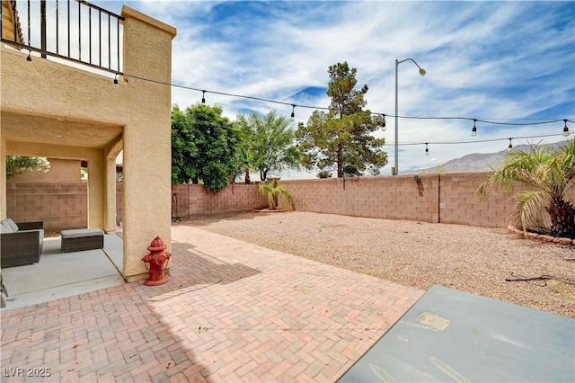 4308 Desert Haven Ave, North Las Vegas, NV 89085 - fenced backyard with a patio area