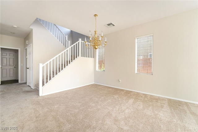 8109 Retriever Ave, Las Vegas, NV 89147 - unfurnished room with a chandelier, carpet floors, and stairway