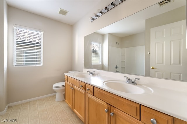 8109 Retriever Ave, Las Vegas, NV 89147 - bathroom with double vanity, a shower, and tile patterned floors
