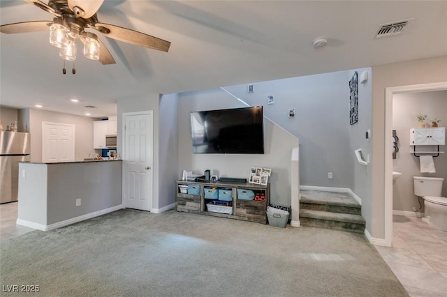 1130 E Dorrell Ln, North Las Vegas, NV 89086 - living room with light colored carpet, ceiling fan, recessed lighting, baseboards, and light tile patterned flooring