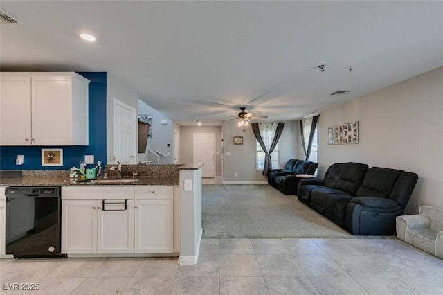 1130 E Dorrell Ln, North Las Vegas, NV 89086 - kitchen with dishwasher, open floor plan, light carpet, a sink, and a ceiling fan