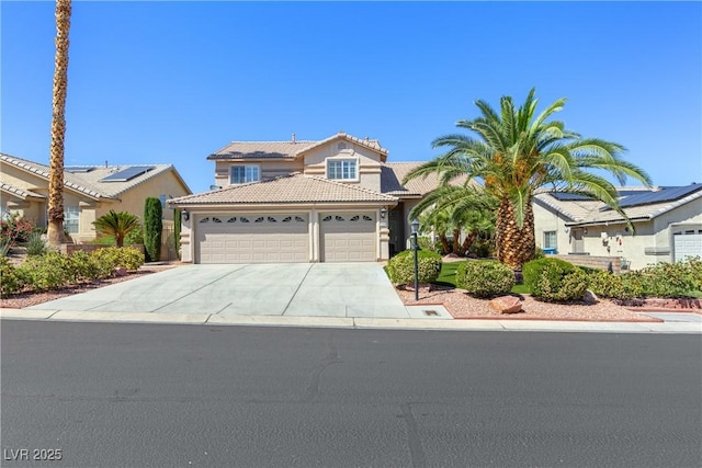 5104 Burr Oak Dr, Las Vegas, NV 89130 - traditional home with an attached garage, concrete driveway, a tiled roof, and stucco siding