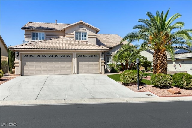5104 Burr Oak Dr, Las Vegas, NV 89130 - view of front of house with a garage, concrete driveway, a tile roof, and stucco siding