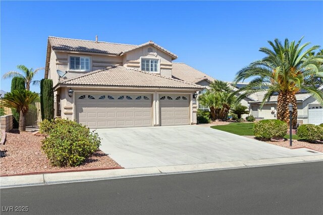 5104 Burr Oak Dr, Las Vegas, NV 89130 - view of front facade with a tile roof, an attached garage, driveway, and stucco siding
