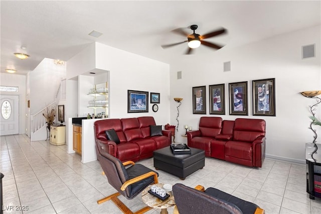 5104 Burr Oak Dr, Las Vegas, NV 89130 - living area with light tile patterned floors, ceiling fan, and stairs