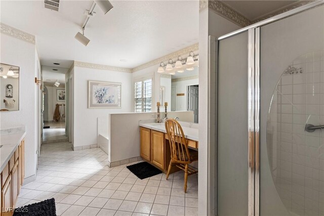 5104 Burr Oak Dr, Las Vegas, NV 89130 - bathroom featuring vanity, a stall shower, tile patterned floors, and a bath
