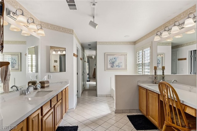 5104 Burr Oak Dr, Las Vegas, NV 89130 - full bathroom featuring tile patterned floors, two vanities, and a bathtub