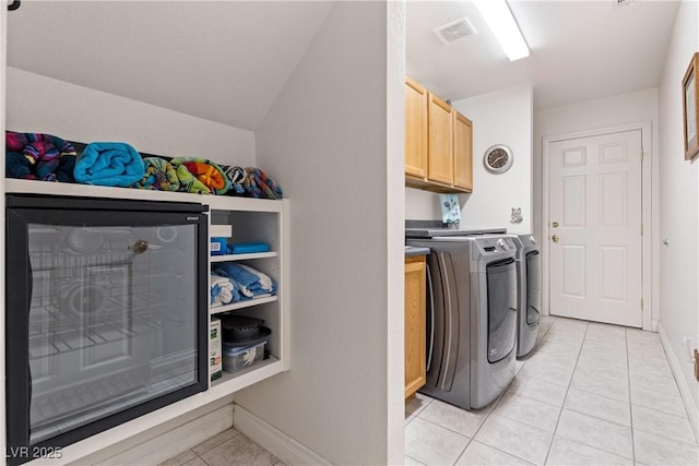 5104 Burr Oak Dr, Las Vegas, NV 89130 - laundry room with independent washer and dryer, cabinet space, light tile patterned floors, and baseboards
