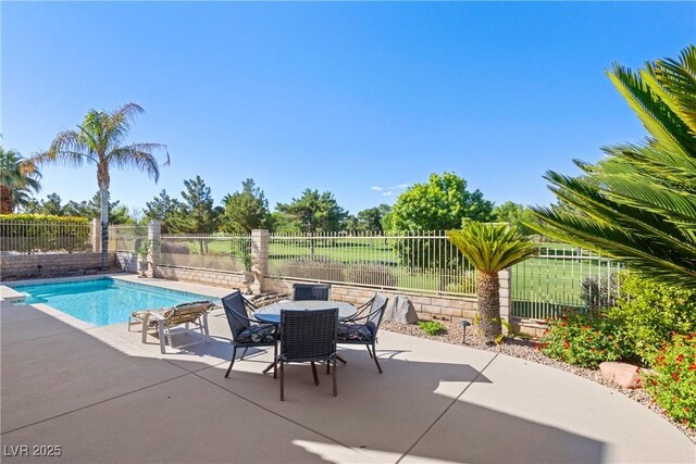 5104 Burr Oak Dr, Las Vegas, NV 89130 - view of swimming pool featuring a patio, a fenced backyard, and outdoor dining area