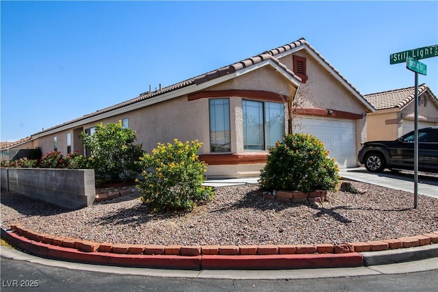 6520 Blooming Sun Ct, Las Vegas, NV 89142 - ranch-style home featuring a garage, stucco siding, a tiled roof, and driveway