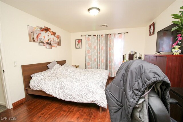 6520 Blooming Sun Ct, Las Vegas, NV 89142 - bedroom featuring dark wood-style floors and baseboards
