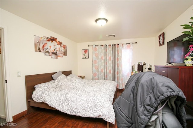 6520 Blooming Sun Ct, Las Vegas, NV 89142 - bedroom featuring dark wood-style flooring and baseboards