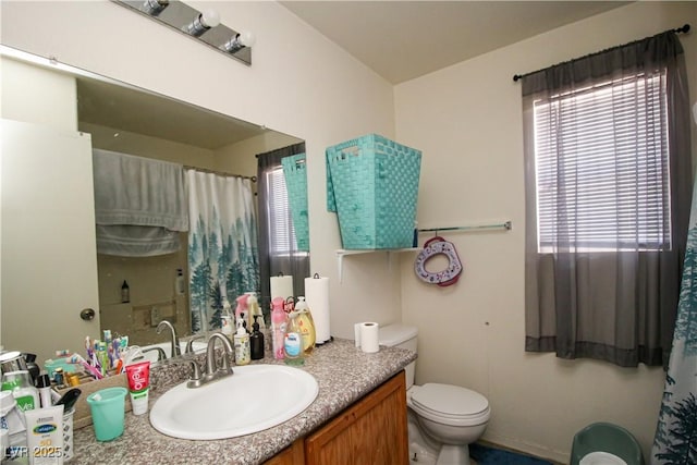 6520 Blooming Sun Ct, Las Vegas, NV 89142 - bathroom with vanity, toilet, plenty of natural light, and a shower with shower curtain