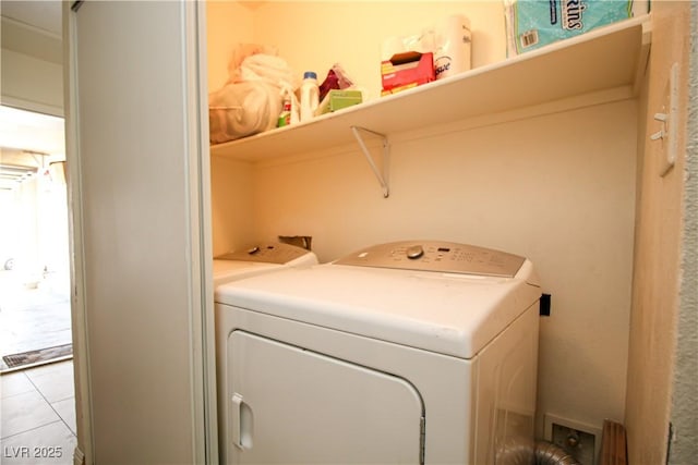 6520 Blooming Sun Ct, Las Vegas, NV 89142 - laundry area with independent washer and dryer and light tile patterned flooring