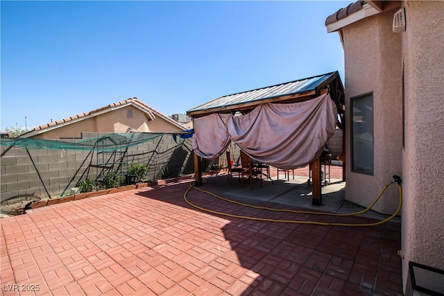 6520 Blooming Sun Ct, Las Vegas, NV 89142 - fenced backyard featuring a patio