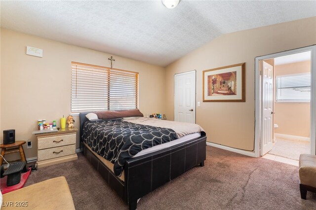 6529 Hartwood Rd, Las Vegas, NV 89108 - carpeted bedroom with lofted ceiling and baseboards