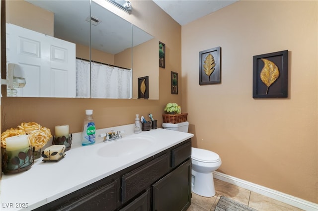 6529 Hartwood Rd, Las Vegas, NV 89108 - bathroom featuring vanity, toilet, baseboards, and tile patterned flooring