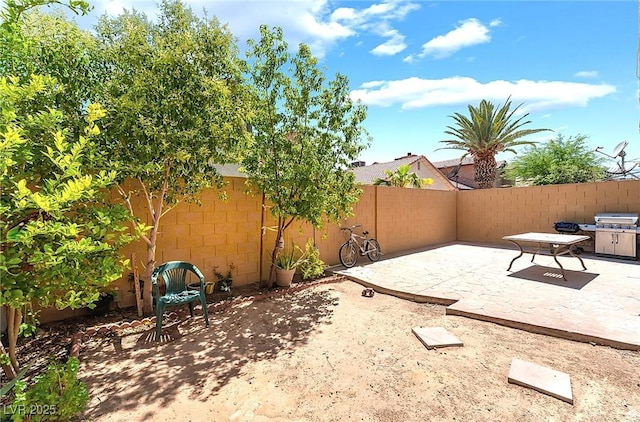 6529 Hartwood Rd, Las Vegas, NV 89108 - fenced backyard featuring a patio area and a grill