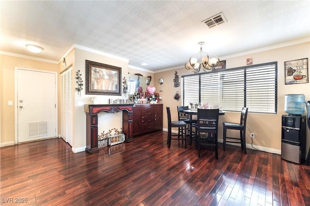 6529 Hartwood Rd, Las Vegas, NV 89108 - dining space featuring a chandelier, hardwood / wood-style flooring, baseboards, and crown molding