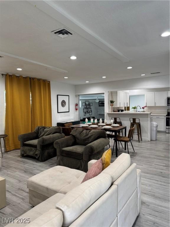 621 S 9th St, Las Vegas, NV 89101 - living room with light wood-style flooring and recessed lighting