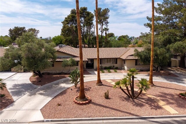 4219 E Pinecrest Cir, Las Vegas, NV 89121 - single story home with a tile roof and curved driveway