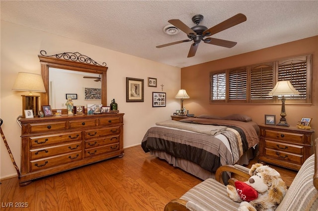 4219 E Pinecrest Cir, Las Vegas, NV 89121 - bedroom featuring a textured ceiling, wood finished floors, and ceiling fan