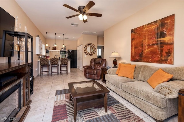 4219 E Pinecrest Cir, Las Vegas, NV 89121 - living room featuring light tile patterned floors, a ceiling fan, and plenty of natural light