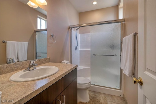 4219 E Pinecrest Cir, Las Vegas, NV 89121 - bathroom with a stall shower, toilet, vanity, and tile patterned floors