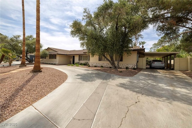 4219 E Pinecrest Cir, Las Vegas, NV 89121 - single story home with curved driveway and an attached carport