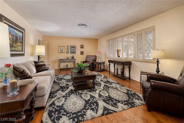4219 E Pinecrest Cir, Las Vegas, NV 89121 - living area featuring a textured ceiling and wood finished floors