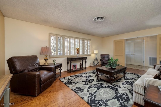 4219 E Pinecrest Cir, Las Vegas, NV 89121 - living area with wood finished floors and a textured ceiling