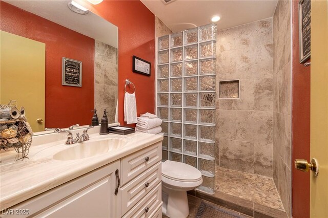 4219 E Pinecrest Cir, Las Vegas, NV 89121 - bathroom with walk in shower, vanity, and toilet