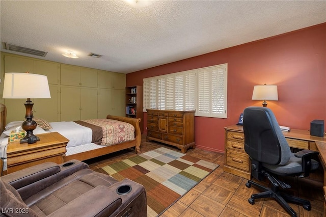 4219 E Pinecrest Cir, Las Vegas, NV 89121 - bedroom featuring a desk, a textured ceiling, baseboards, and a closet