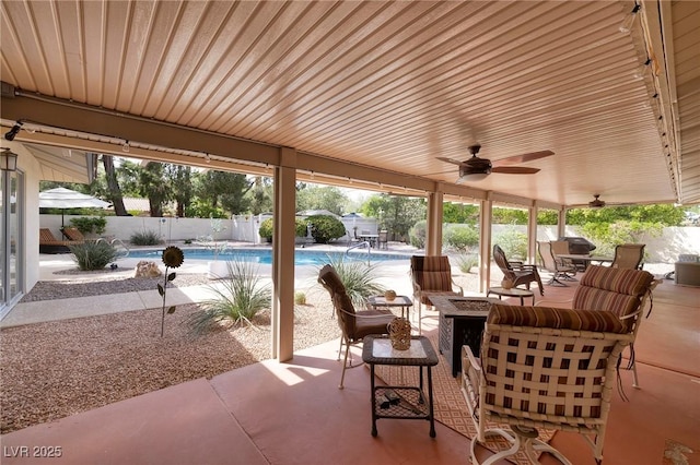 4219 E Pinecrest Cir, Las Vegas, NV 89121 - fenced backyard with a fire pit, a patio, ceiling fan, and outdoor dining space