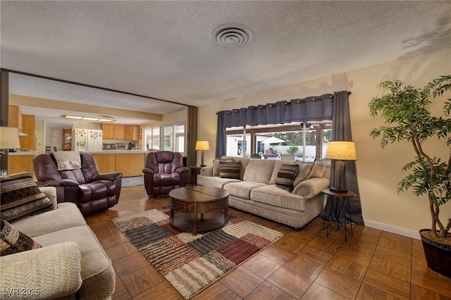 4219 E Pinecrest Cir, Las Vegas, NV 89121 - living area with a textured ceiling and baseboards