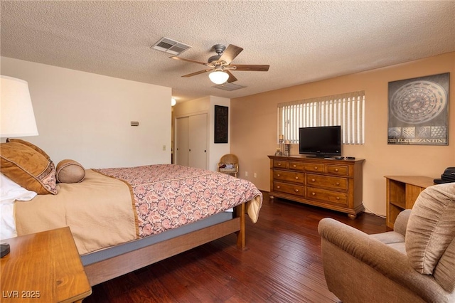 4219 E Pinecrest Cir, Las Vegas, NV 89121 - bedroom with hardwood / wood-style flooring, a textured ceiling, a closet, and a ceiling fan