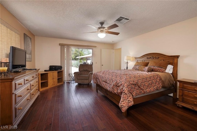 4219 E Pinecrest Cir, Las Vegas, NV 89121 - bedroom with access to outside, dark wood-style floors, a textured ceiling, and ceiling fan