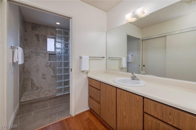 4219 E Pinecrest Cir, Las Vegas, NV 89121 - bathroom with walk in shower, vanity, and wood finished floors