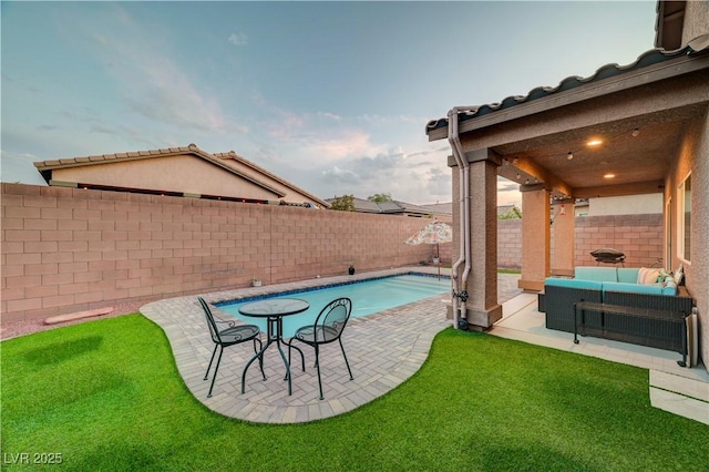 7235 Summer Air Ave, Las Vegas, NV 89179 - fenced backyard with an outdoor living space and a patio area
