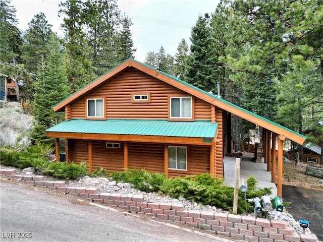 401 Alpine Way, Las Vegas, NV 89124 - cabin featuring log exterior, a carport, and metal roof