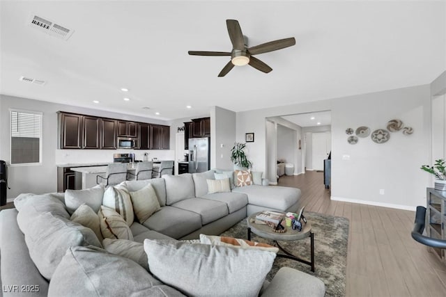 7115 Calvert Cliffs St, North Las Vegas, NV 89084 - living room with ceiling fan, light wood-type flooring, baseboards, and recessed lighting