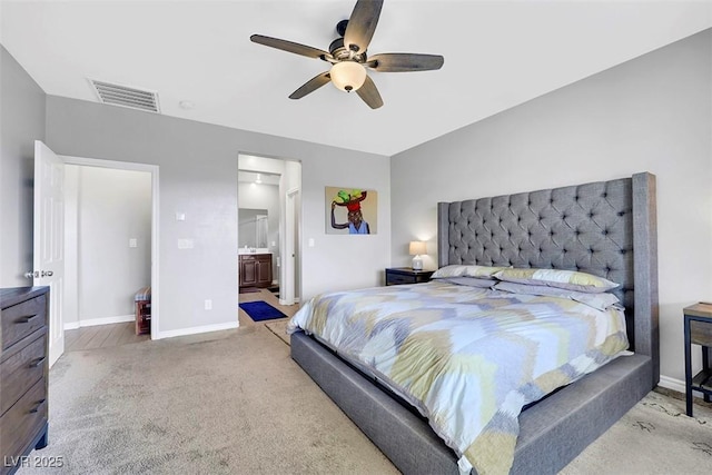 7115 Calvert Cliffs St, North Las Vegas, NV 89084 - carpeted bedroom with baseboards, ceiling fan, and connected bathroom