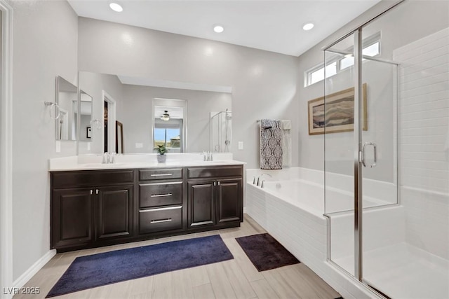 7115 Calvert Cliffs St, North Las Vegas, NV 89084 - full bathroom with a bath, double vanity, a stall shower, and recessed lighting