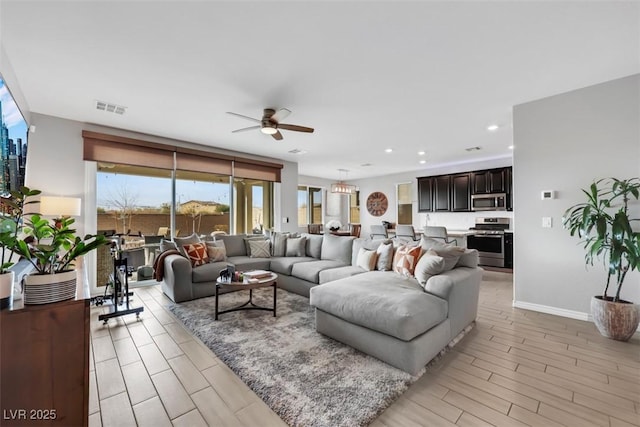 7115 Calvert Cliffs St, North Las Vegas, NV 89084 - living room featuring ceiling fan, light wood finished floors, baseboards, and recessed lighting
