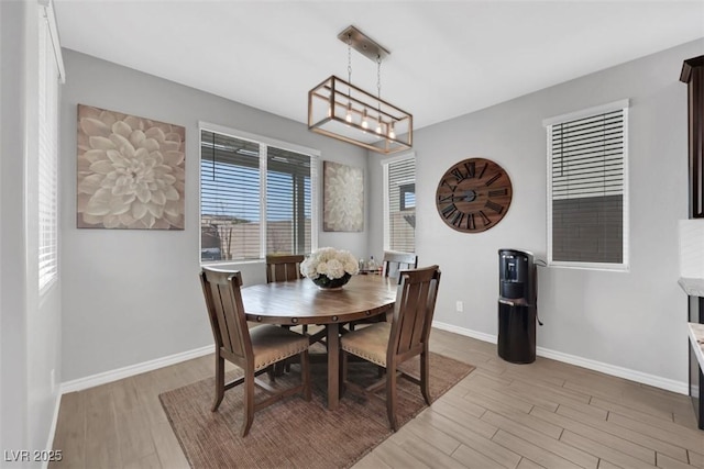 7115 Calvert Cliffs St, North Las Vegas, NV 89084 - dining space featuring light wood-type flooring and baseboards