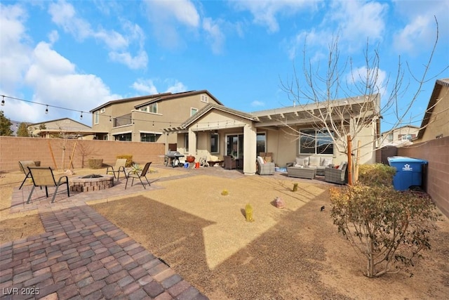 7115 Calvert Cliffs St, North Las Vegas, NV 89084 - back of house with an outdoor living space with a fire pit, a patio area, a fenced backyard, and stucco siding